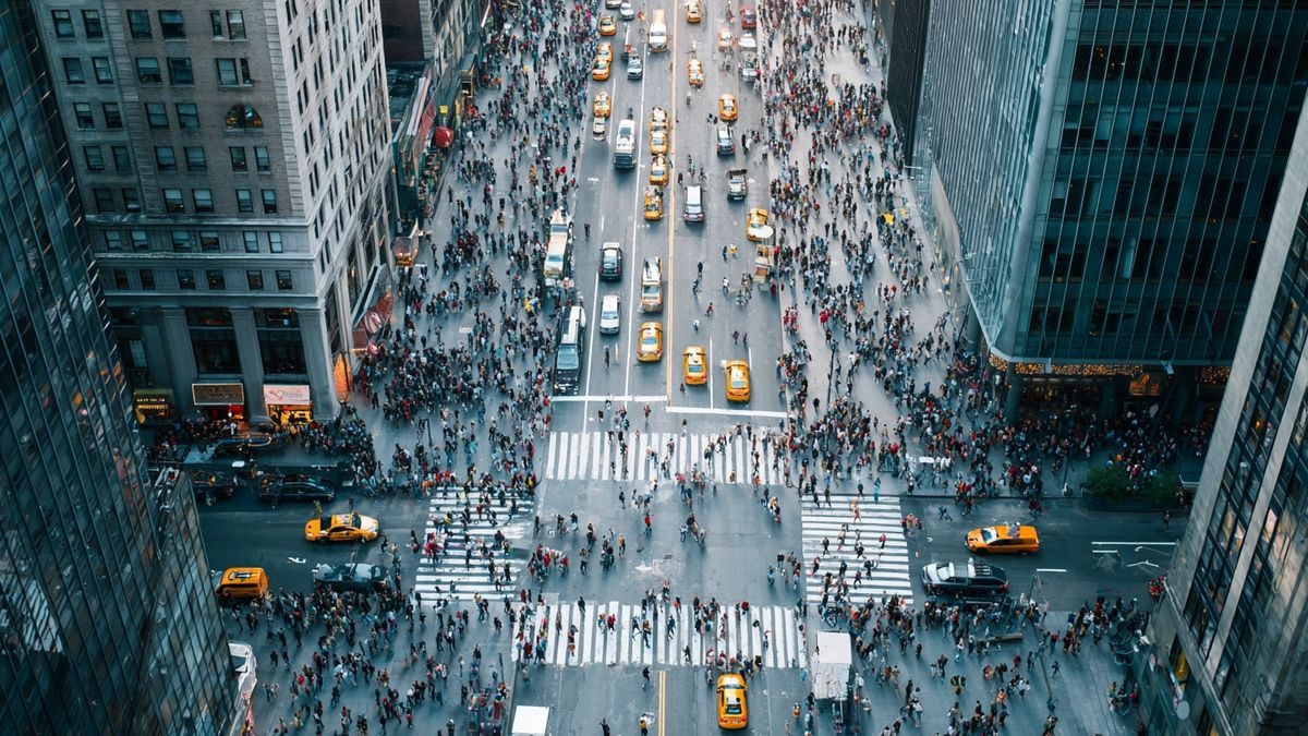 Aerial view of a vibrant and bustling New York City street representing the city's dynamic financial environment.